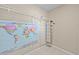 Walk-in closet features a world map, wire shelving, and a shoe organizer at 8056 Piney River Ave, Littleton, CO 80125