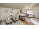 Bright dining room features hardwood floors and a built-in fireplace at 11228 W Progress Ave, Littleton, CO 80127