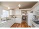 Clean kitchen with white cabinets and stainless steel appliances at 11228 W Progress Ave, Littleton, CO 80127