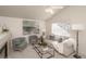 Cozy living room with neutral decor and a fireplace at 11228 W Progress Ave, Littleton, CO 80127