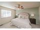 Spacious main bedroom with neutral wall color and plush bedding at 11228 W Progress Ave, Littleton, CO 80127