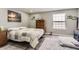 Cozy bedroom with ample natural light, a comfortable queen-sized bed, and a warm, inviting ambiance at 7465 S Ivy Way, Centennial, CO 80112