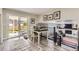 Bright dining area adjacent to the backyard, featuring ample natural light and seamless indoor-outdoor flow at 7465 S Ivy Way, Centennial, CO 80112
