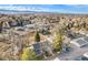 Wide aerial view of a neighborhood with the mountains and open space in the background at 8348 W 90Th Ave, Broomfield, CO 80021