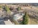 Back exterior of a home with a deck and patio in a well-maintained yard at 8348 W 90Th Ave, Broomfield, CO 80021