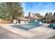 Community pool with a fence and pool house featuring a patio area and lounge chairs at 8348 W 90Th Ave, Broomfield, CO 80021