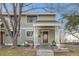 Charming townhome featuring a covered porch and a cozy bench, creating a welcoming entrance at 8348 W 90Th Ave, Broomfield, CO 80021