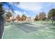 An image of community tennis courts surrounded by trees and neighborhood homes at 8348 W 90Th Ave, Broomfield, CO 80021