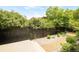 Well-maintained backyard featuring privacy fencing, stone ground cover and professional landscaping at 306 E Iowa Ave, Berthoud, CO 80513