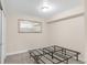 Bedroom with a metal bed frame, carpeted floors, and neutral-toned walls and trim at 306 E Iowa Ave, Berthoud, CO 80513