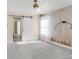 Relaxing bedroom featuring a decorative accent wall and barn door at 306 E Iowa Ave, Berthoud, CO 80513