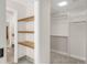 Closet space with shelving and clothing rods at 306 E Iowa Ave, Berthoud, CO 80513