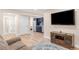 Living room with view to kitchen and comfortable seating at 306 E Iowa Ave, Berthoud, CO 80513