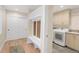 Mudroom featuring coat rack, storage, and laundry machines at 306 E Iowa Ave, Berthoud, CO 80513