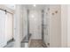 Beautiful walk-in shower featuring a bench and modern fixtures at 306 E Iowa Ave, Berthoud, CO 80513