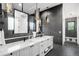 Beautiful bathroom with double vanity, modern fixtures, and a view to the bedroom at 1035 S Josephine St, Denver, CO 80209