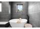 Luxurious bathroom featuring a standalone tub and sleek, modern design at 1035 S Josephine St, Denver, CO 80209