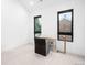 Bright bedroom showcasing sleek black framed windows and a neutral color palette at 1035 S Josephine St, Denver, CO 80209