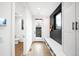 Bright entryway features a built-in bench with storage and a view of the backyard at 1035 S Josephine St, Denver, CO 80209