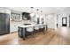 Spacious kitchen with large center island, modern lighting, and stainless steel appliances at 1035 S Josephine St, Denver, CO 80209