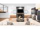 Stylish living room featuring fireplace, large windows, and comfortable seating at 1035 S Josephine St, Denver, CO 80209