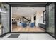 Open floor plan with large sliding glass doors leads to the home's cozy living room at 1035 S Josephine St, Denver, CO 80209