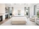 Spacious main bedroom with fireplace, plush carpet, and abundant natural light at 1035 S Josephine St, Denver, CO 80209
