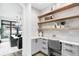 Cozy home office with built-in desk, floating shelves, and natural light at 1035 S Josephine St, Denver, CO 80209