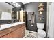 Bathroom featuring a modern vanity, decorative shelves, and sleek fixtures at 8371 S Upham Way # 208, Littleton, CO 80128