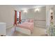 Bright bedroom featuring a comfy bed, neutral carpet, and walk in closet at 8371 S Upham Way # 208, Littleton, CO 80128