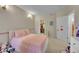 Comfortable bedroom with an inviting atmosphere, featuring a soft bed and ample closet space at 8371 S Upham Way # 208, Littleton, CO 80128