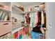 Well-organized closet space with ample storage, featuring shelving, hanging rods, and colorful bins at 8371 S Upham Way # 208, Littleton, CO 80128