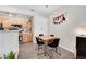 Cozy dining area with natural light and a view into the kitchen at 8371 S Upham Way # 208, Littleton, CO 80128
