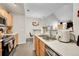 Well-lit kitchen featuring stainless steel appliances and updated countertops at 8371 S Upham Way # 208, Littleton, CO 80128