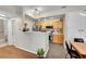 Efficient kitchen with wood cabinets and stainless steel appliances at 8371 S Upham Way # 208, Littleton, CO 80128