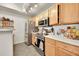 Updated kitchen boasts stainless steel appliances and ample cabinet space at 8371 S Upham Way # 208, Littleton, CO 80128