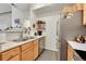 Functional kitchen with stainless steel appliances, wood cabinets, and a convenient layout at 8371 S Upham Way # 208, Littleton, CO 80128