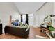 Cozy living room featuring wood floors, vaulted ceiling, and an abundance of natural light at 8371 S Upham Way # 208, Littleton, CO 80128