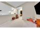 Cozy loft space featuring neutral carpet, decor items and furniture at 8371 S Upham Way # 208, Littleton, CO 80128