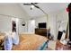 Bright main bedroom with vaulted ceilings, four-poster bed, and access to a walk-in closet at 8371 S Upham Way # 208, Littleton, CO 80128