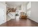 Expansive dining area with soaring ceilings, lots of natural light, and wooden staircase for elegant gatherings at 1335 Galactic Pl, Castle Rock, CO 80108