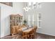 Dining room with a grand hutch, wood table set, and plenty of natural light, creating an inviting atmosphere at 1335 Galactic Pl, Castle Rock, CO 80108