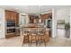 Gourmet kitchen includes a center island, stainless appliances, and custom cabinets for ample storage at 1335 Galactic Pl, Castle Rock, CO 80108