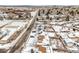 Aerial view of a residential street, showing houses covered in snow at 13390 W 8Th Ave, Lakewood, CO 80401