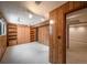 Finished basement room with built-in shelving and carpeting at 13390 W 8Th Ave, Lakewood, CO 80401