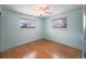 Light blue bedroom with wood flooring and ceiling fan at 13390 W 8Th Ave, Lakewood, CO 80401