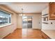 Dining room with hardwood floors, sliding door to deck, and chandelier at 13390 W 8Th Ave, Lakewood, CO 80401