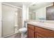 Clean bathroom featuring a walk-in shower, vanity with sink, and ample lighting, providing a refreshing space at 8335 Fairmount Dr # 4-102, Denver, CO 80247