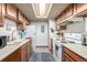 Functional kitchen with ample cabinet space, white appliances, and neutral countertops, ready for culinary adventures at 8335 Fairmount Dr # 4-102, Denver, CO 80247