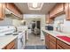 Efficient kitchen layout with warm wood cabinets and a view to the dining area, ideal for everyday cooking at 8335 Fairmount Dr # 4-102, Denver, CO 80247